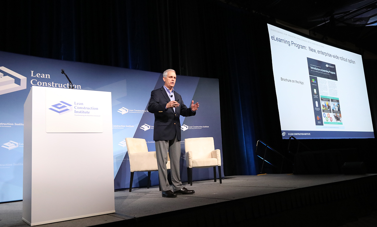 man standing on a lci stage presenting eLearning course introduction