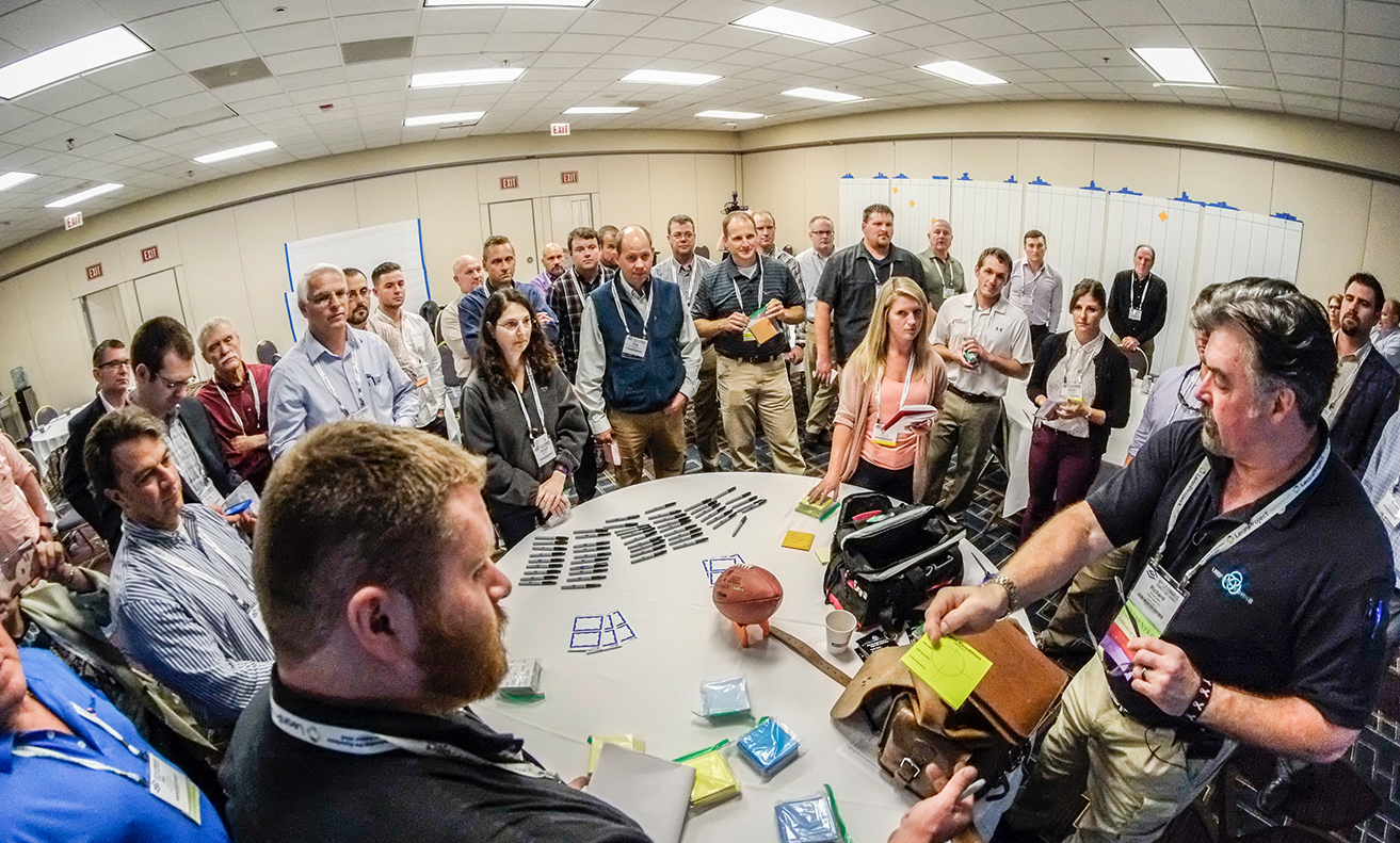 large group of people surrounding a table, fisheye lens shot